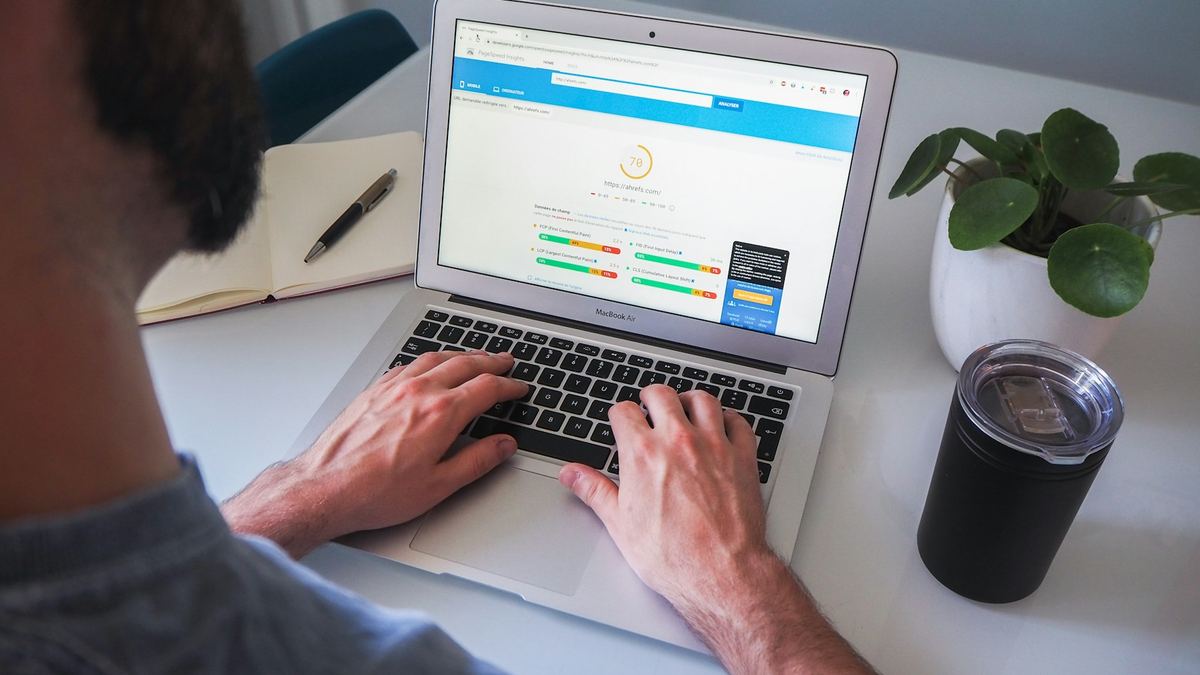 Person working on a laptop checking website performance