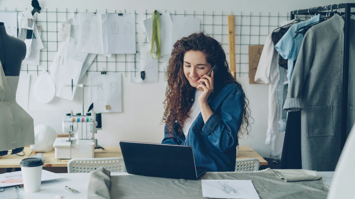 Small business owner on the phone at her studio desk