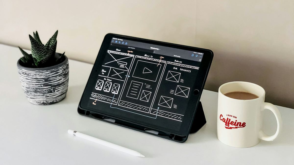 Website wireframe sketches on a tablet